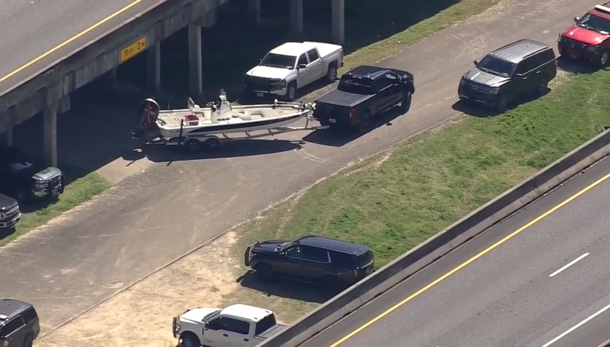 Aerial view of a police boat being towed by a truck near the Trinity River, Photo Credit: Fox News