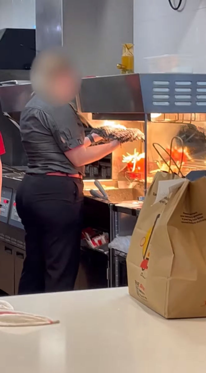 Alleged McDonald's employee at Australian branch caught drying mop under heat lamp meant for French fries, Photo Credit: Storyful Viral/Youtube