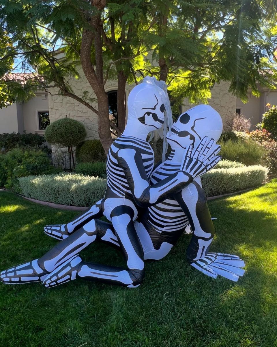 Inflatable skeleton decorations on a lawn from a photo on Kourtney Kardashian's instagram, Photo Credit: kourtneykardash/Instagram