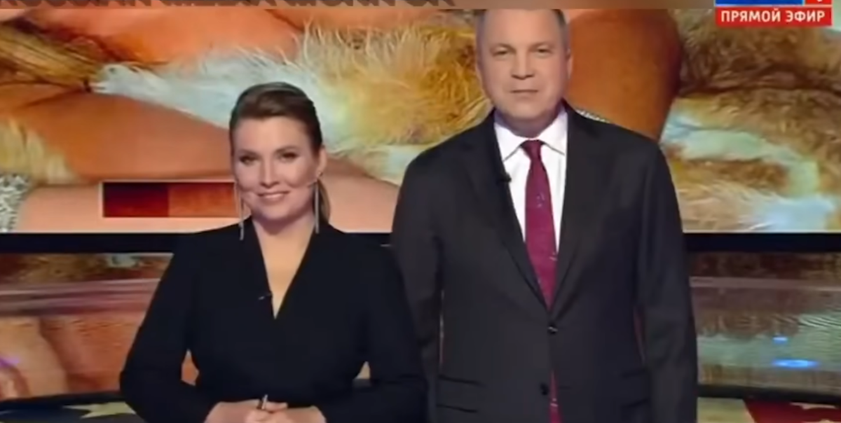 Russian state TV channel anchors during segment where they aired Melania Trump's nude photos, Photo Credit: On Demand News/Youtube