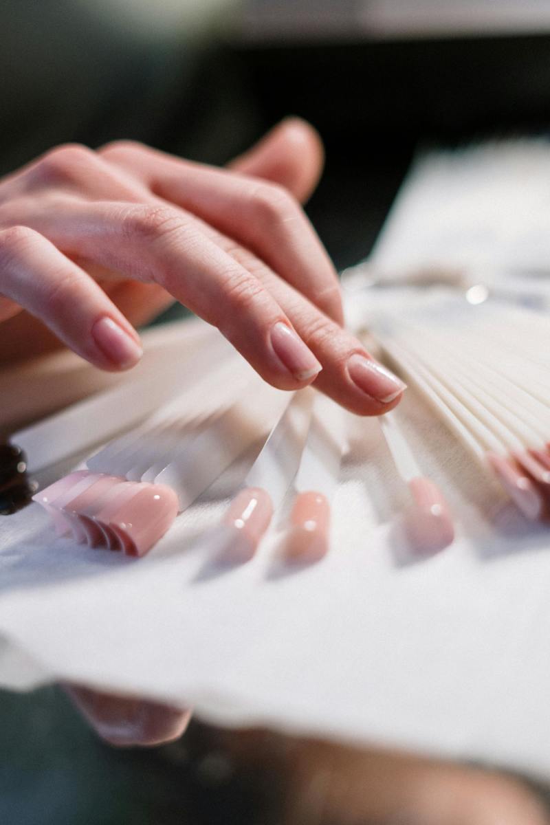 A closeup of a woman's hand with well-manicured nails (for illustrative purposes), Photo Credit: Pexels