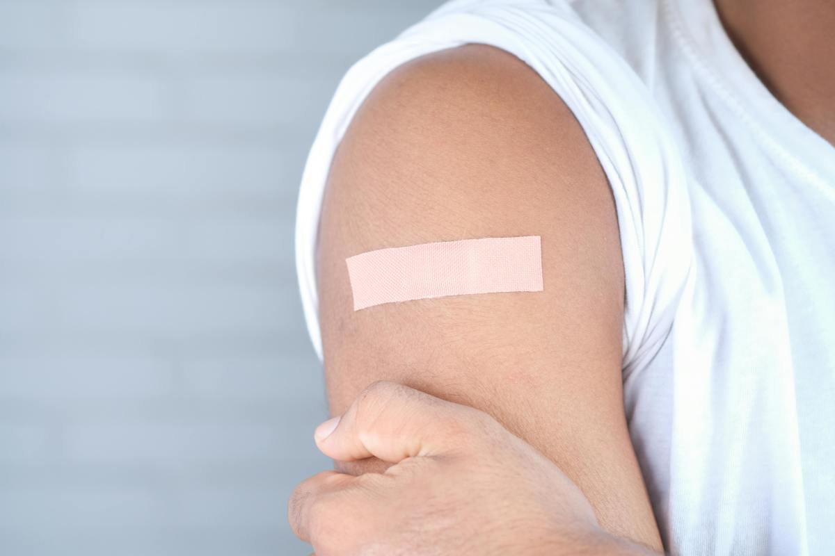 A person's arm with bandaid post-vaccination (for illustrative purposes), Photo Credit: Pexels