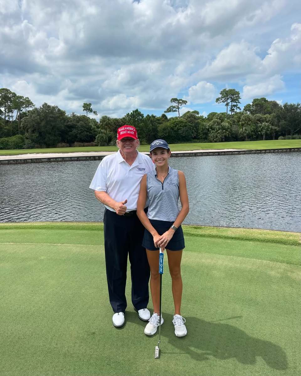 President Trump posing with his granddaughter Kai on the golf course, Photo Credit: kaitrumpgolfer/Instagram