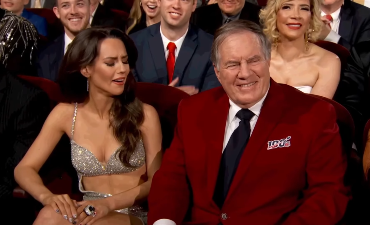 Bill Belichick and Jordon Hudson sitting during the 14th annual NFL Honors event, Photo Credit: Access Hollywood/Youtube