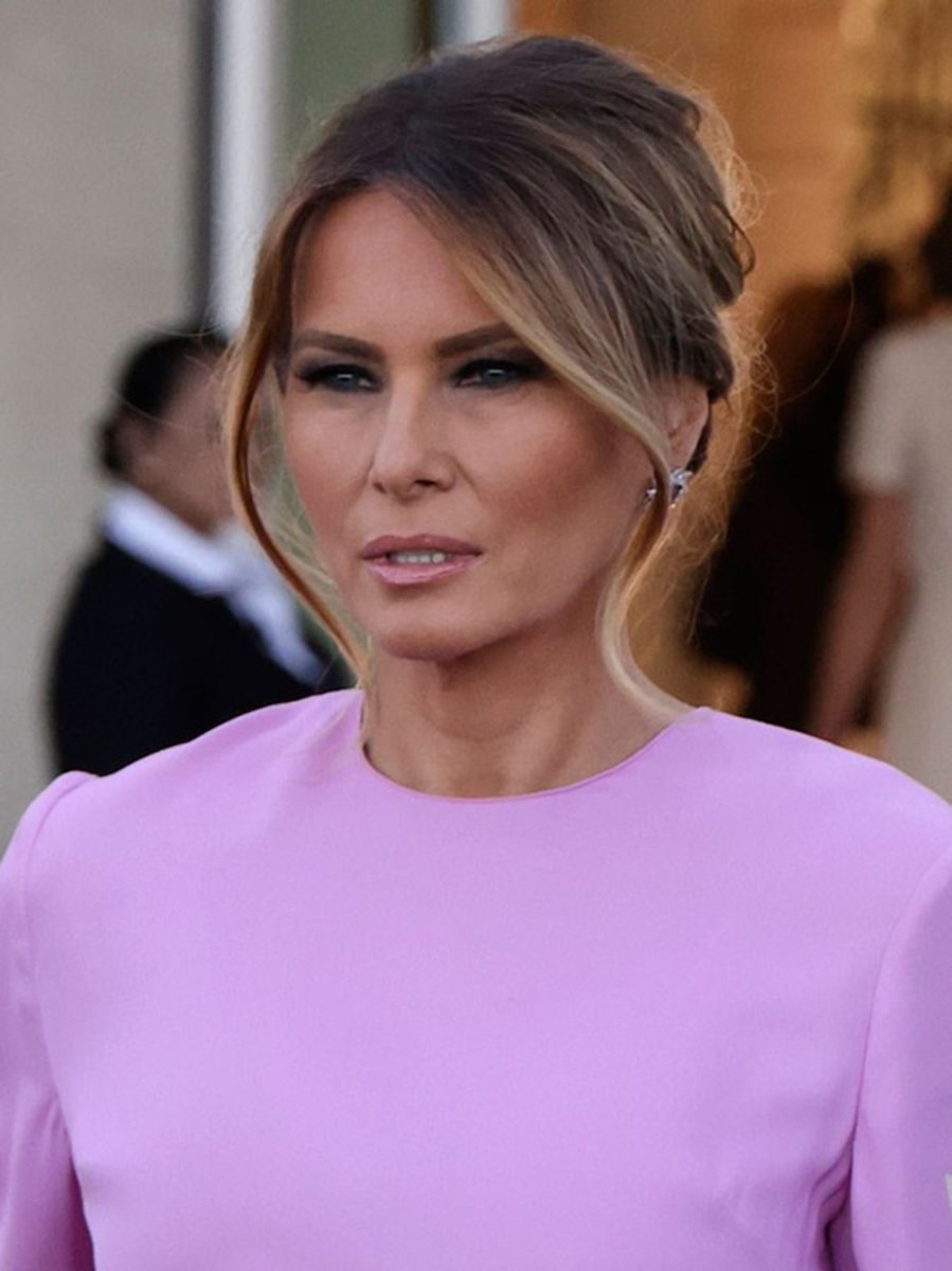 Melania Trump wearing a purple blouse, Photo Credit: FLOTUS Report/X