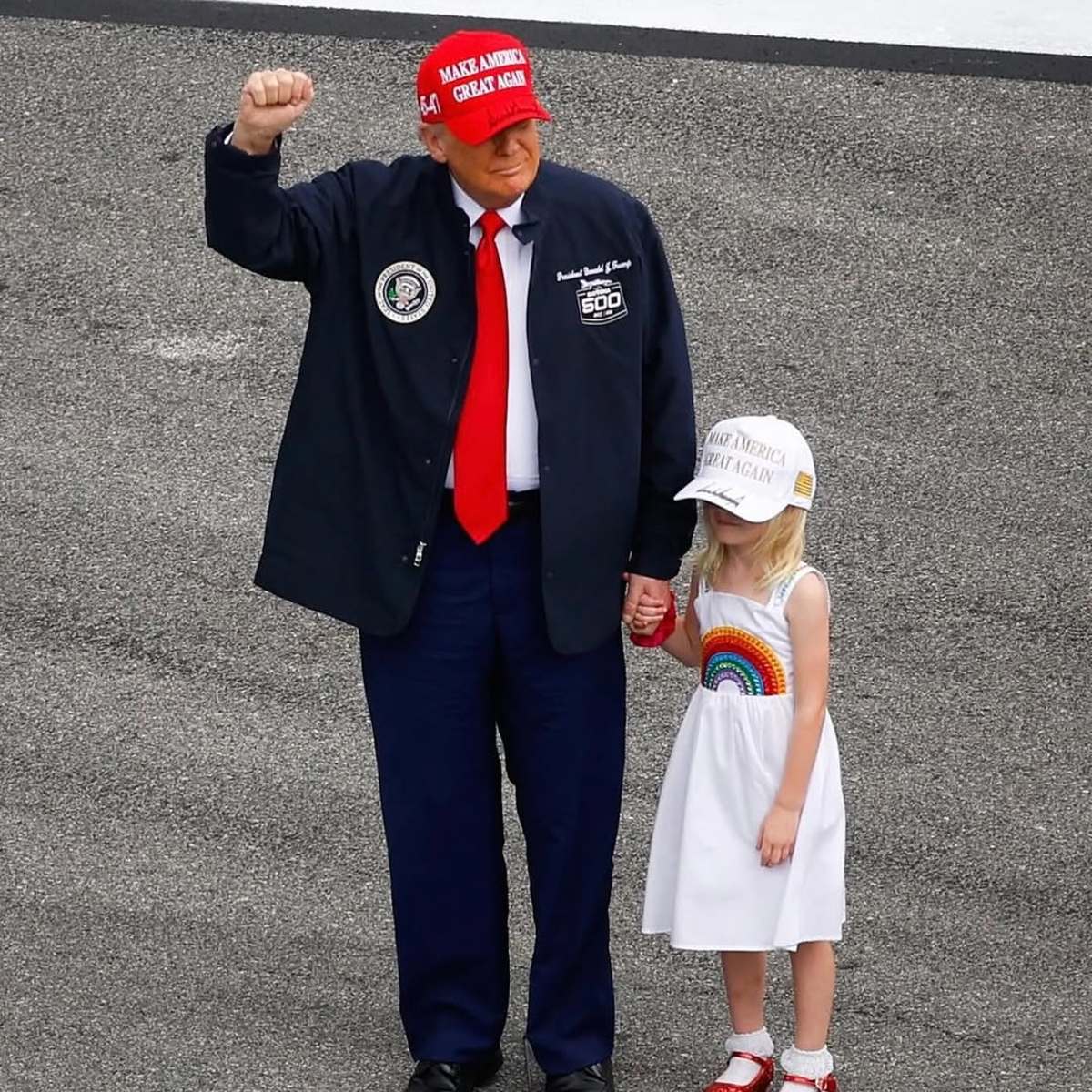 President Donald Trump wearing a MAGA cap standing with a little girl, Photo Credit: realdonaldtrump/Instagram