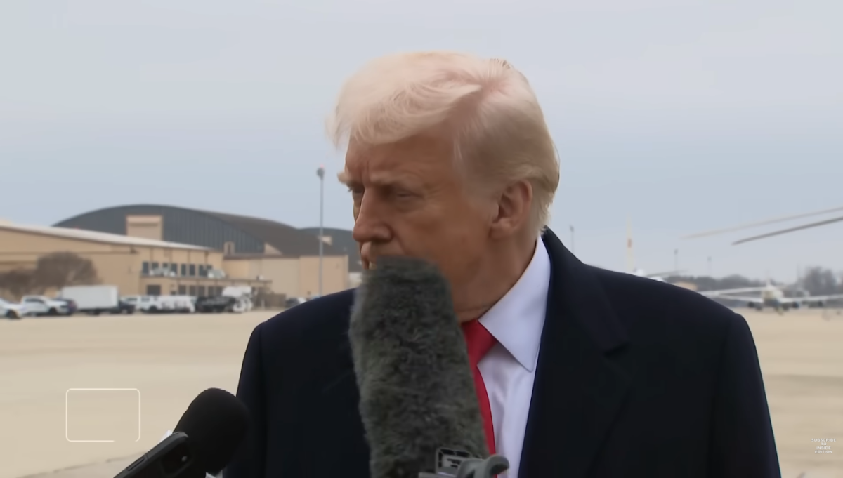 President Donald Trump was hit by a mic while talking to reporters at Joint Base Andrews, Photo Credit: Inside Edition/Youtube